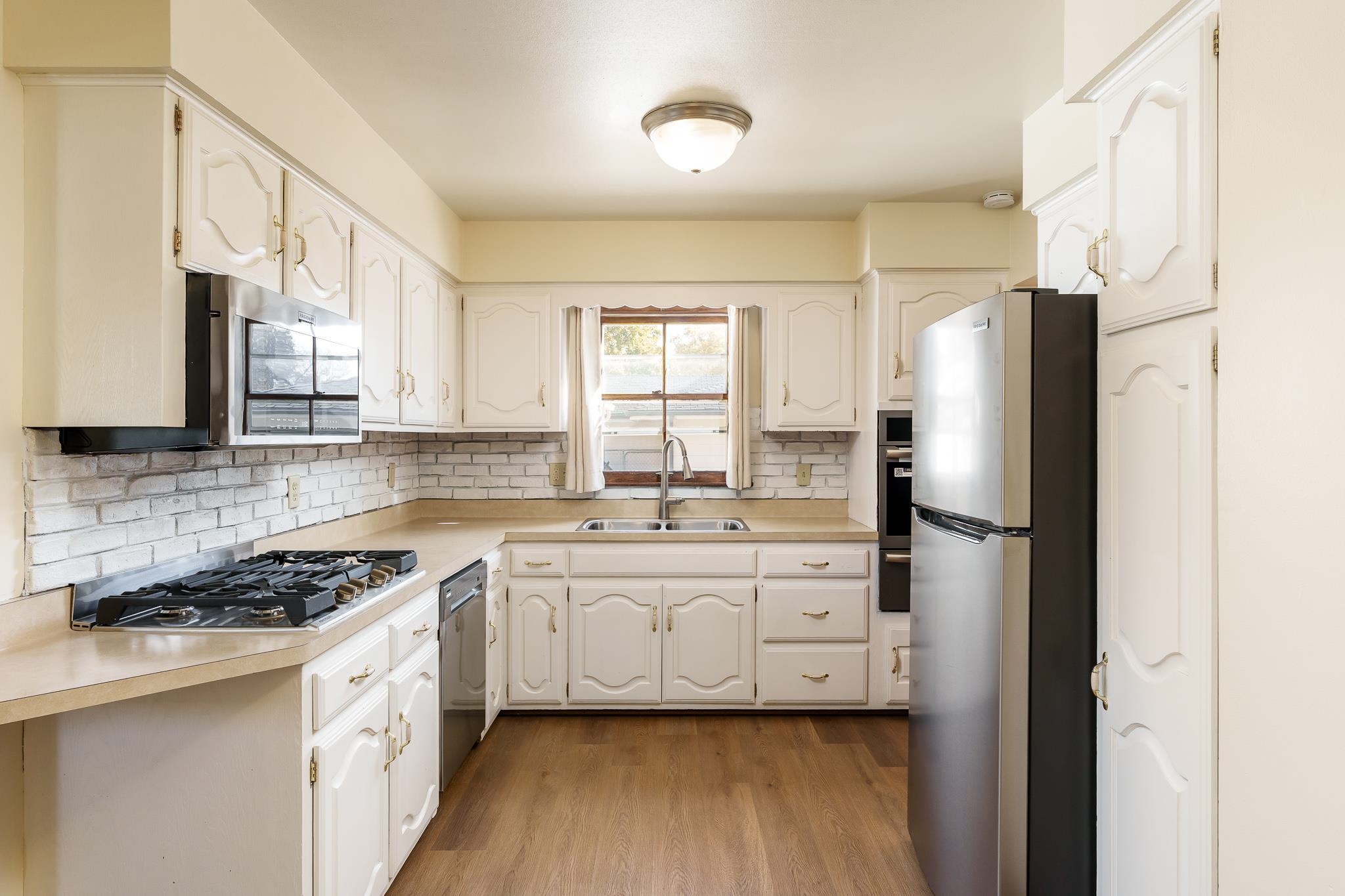 3332 Wesleyan Avenue Rockford, IL 61108 - Photo 22 of 45 a kitchen with stainless steel appliances a refrigerator sink and cabinets