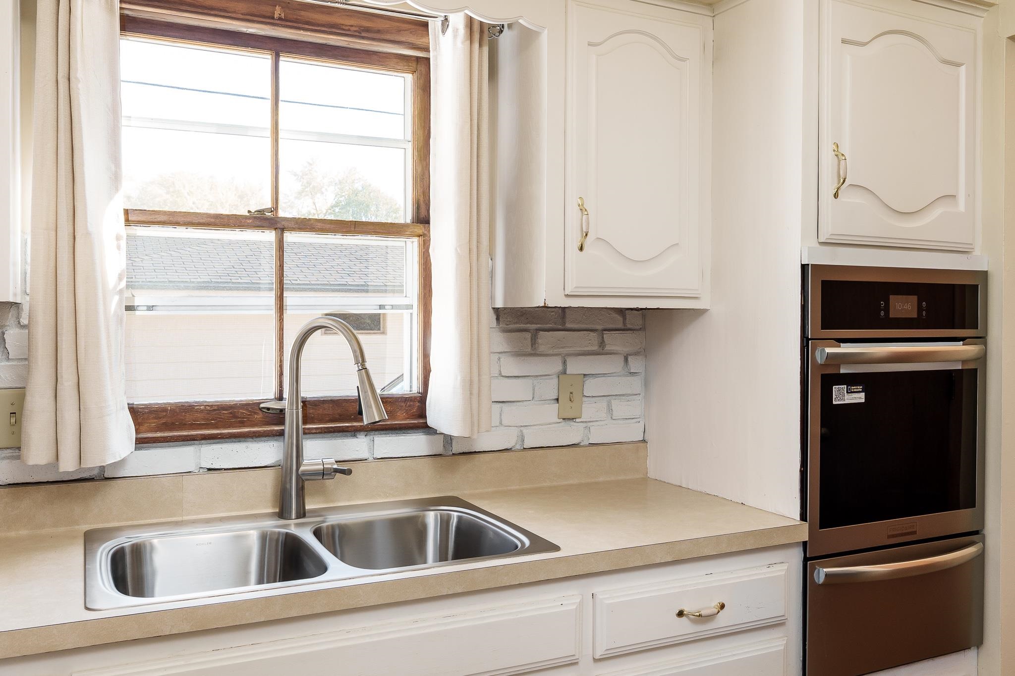 3332 Wesleyan Avenue Rockford, IL 61108 - Photo 23 of 45 a close view of a sink and refrigerator