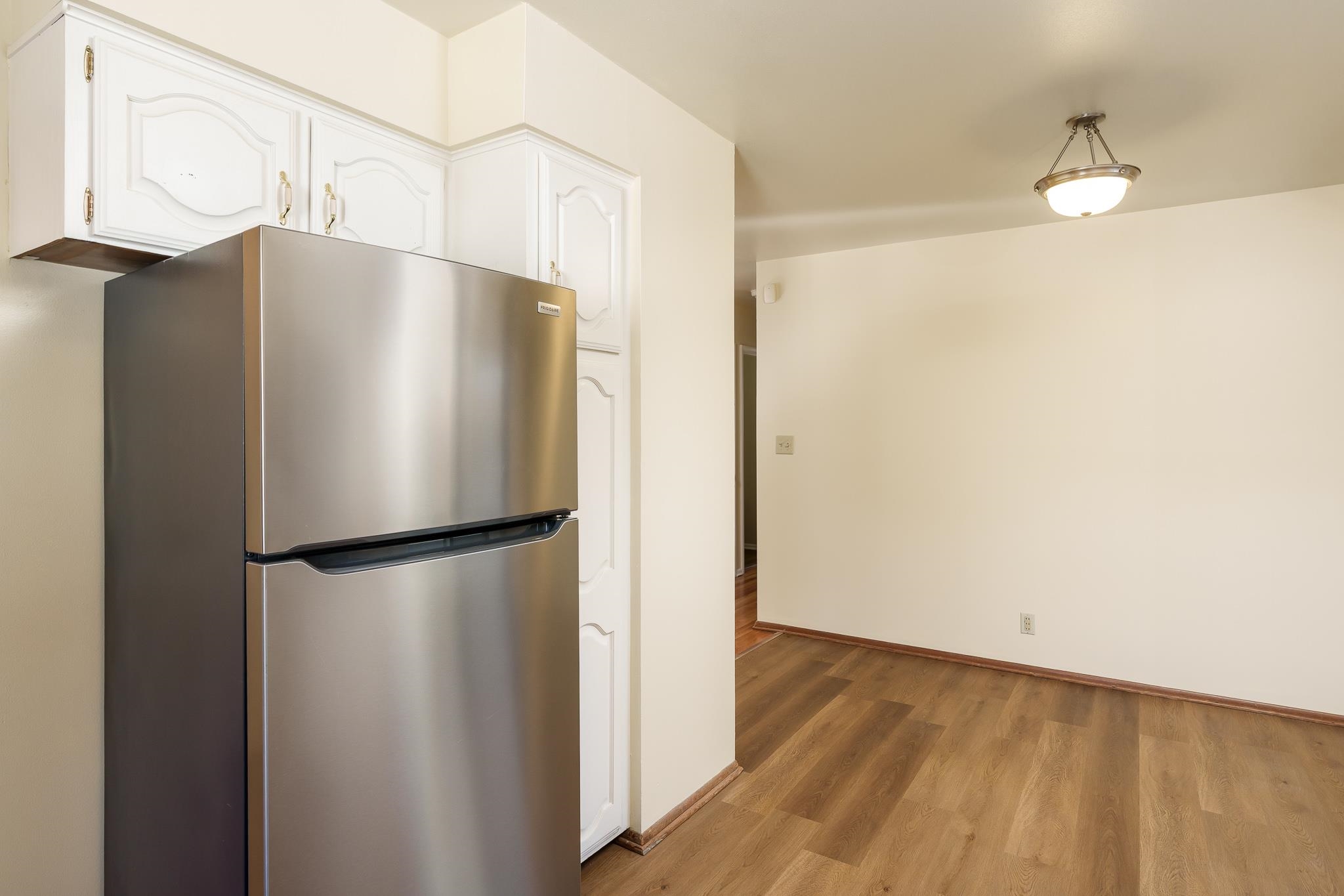 3332 Wesleyan Avenue Rockford, IL 61108 - Photo 24 of 45 a white refrigerator freezer sitting in a kitchen