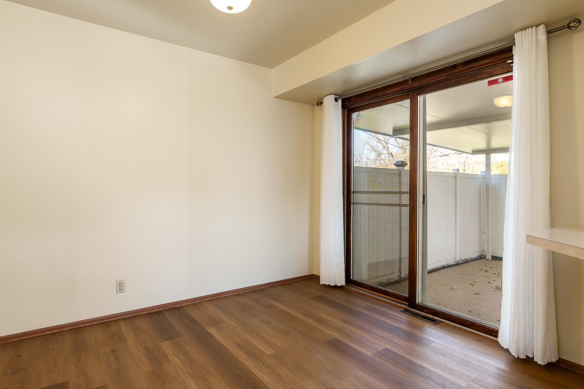 3332 Wesleyan Avenue Rockford, IL 61108 - Photo 26 of 45 an empty room with wooden floor and windows