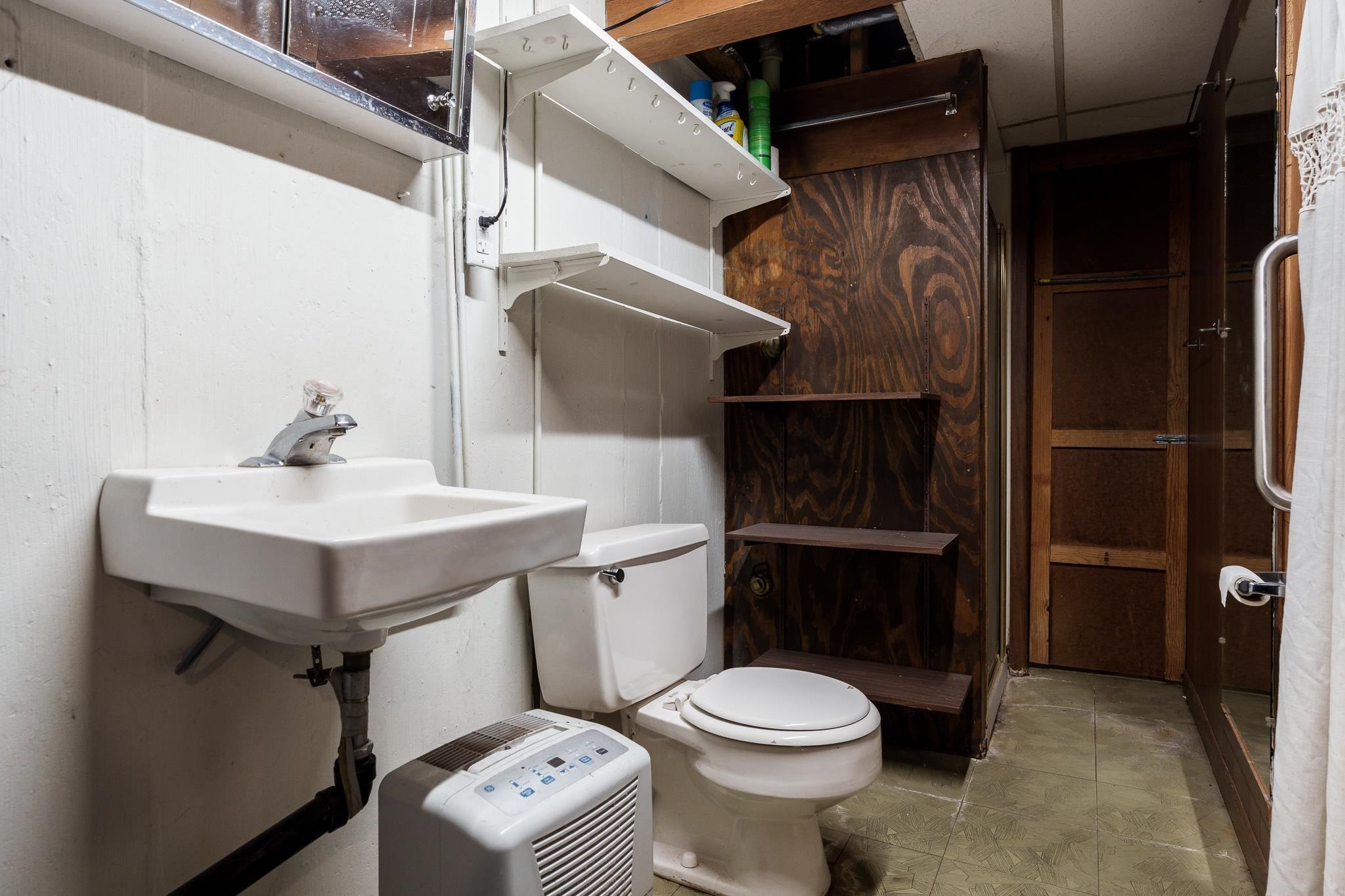 3332 Wesleyan Avenue Rockford, IL 61108 - Photo 35 of 45 a bathroom with a sink toilet and shower