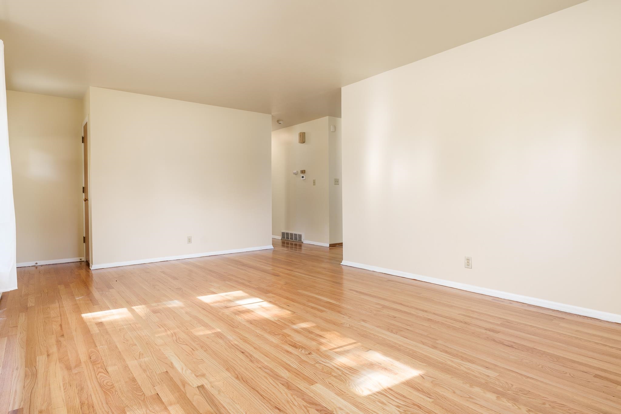 3332 Wesleyan Avenue Rockford, IL 61108 - Photo 7 of 45 a view of an empty room and wooden floor