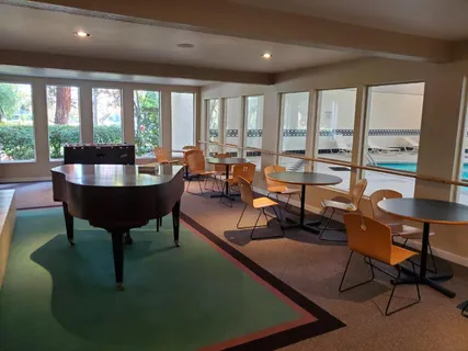 a large room with gym equipment and a large window