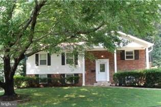 7705 Carrleigh Parkway Springfield, VA 22152 - Photo 1 of 1 a front view of a house with a yard