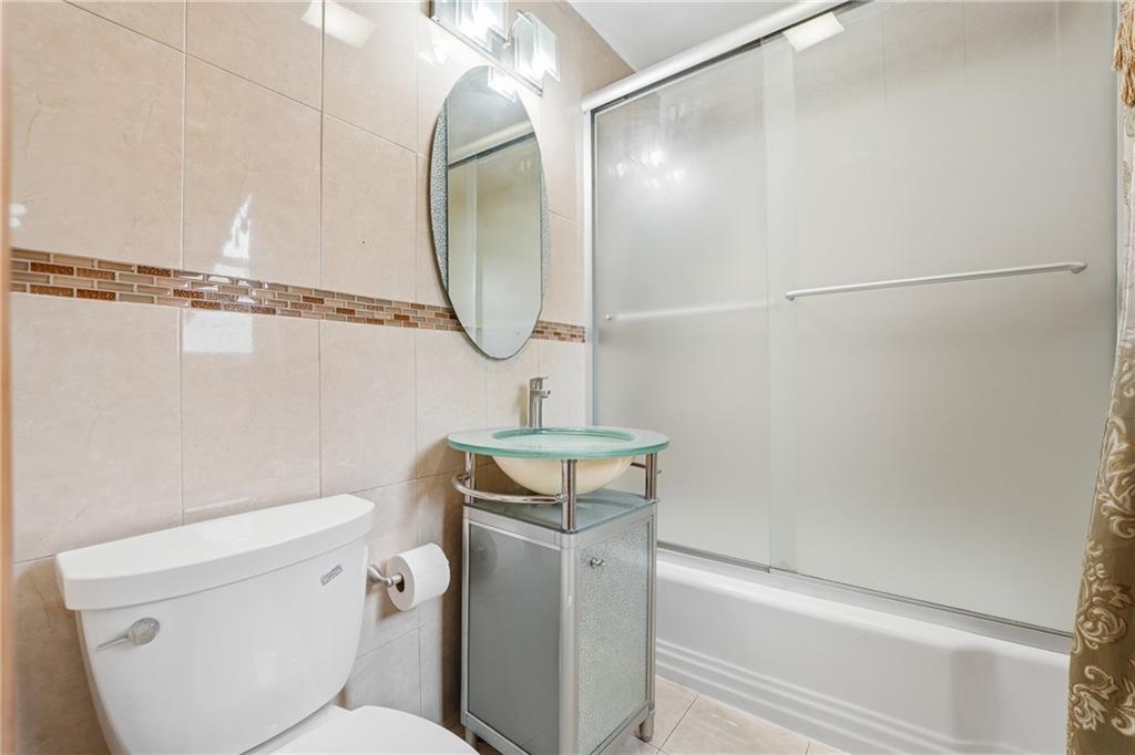 460 North Maple Street Mercer, PA 16137 - Photo 14 of 32 a bathroom with a sink a toilet and shower