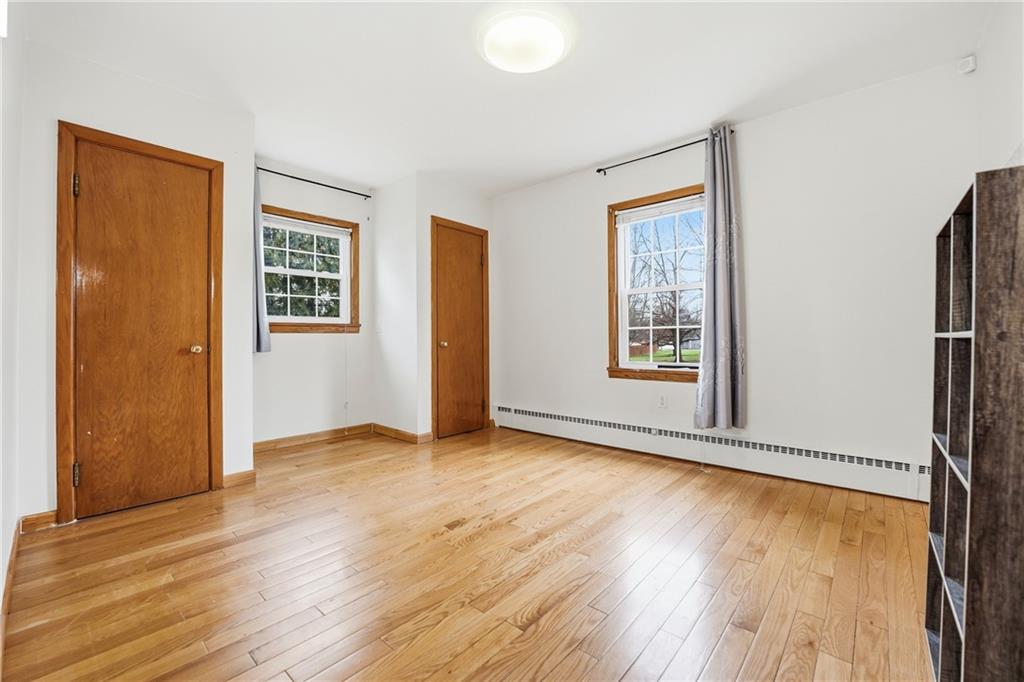 460 North Maple Street Mercer, PA 16137 - Photo 15 of 32 an empty room with wooden floor and windows