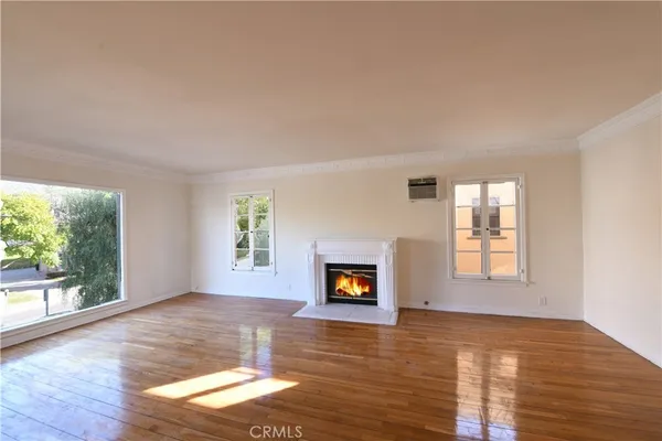 a view of a living room a window and a fireplace