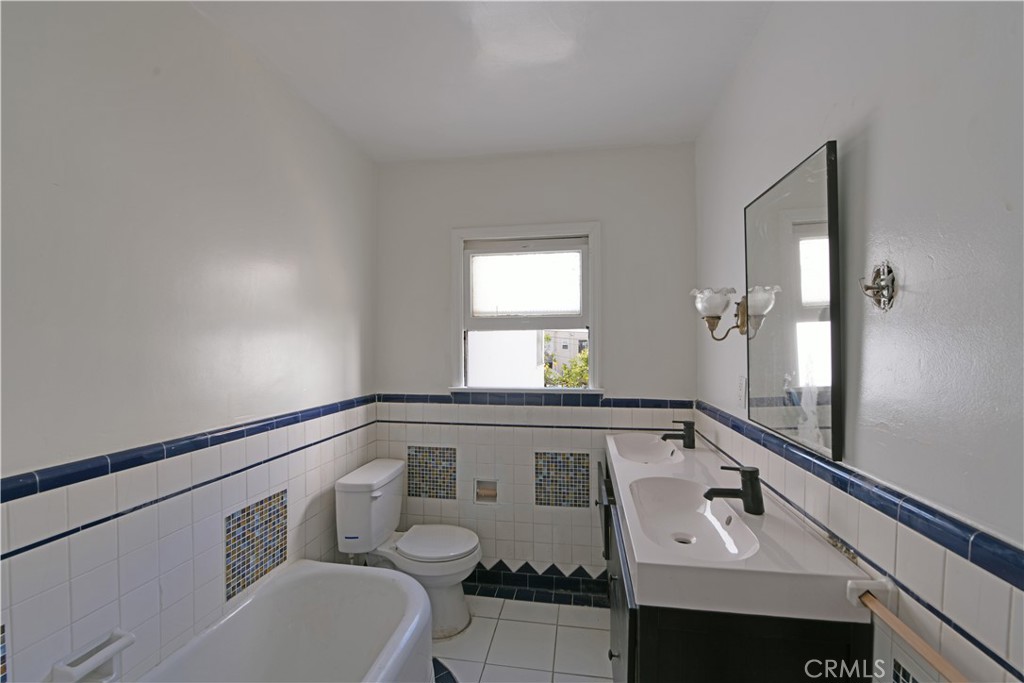 915 Le Doux Road Los Angeles, CA 90035 - Photo 14 of 30 a bathroom with a sink and a mirror
