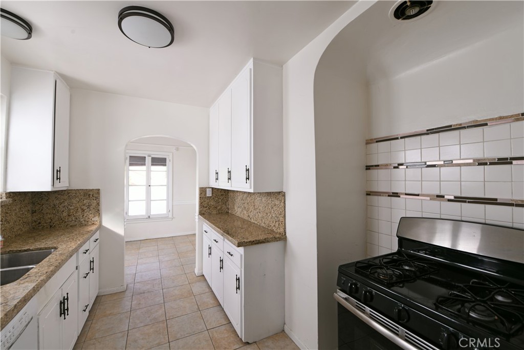 915 Le Doux Road Los Angeles, CA 90035 - Photo 10 of 30 a kitchen with granite countertop cabinets and steel stainless steel appliances