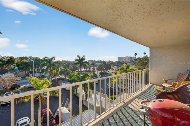 a view of a balcony with chairs