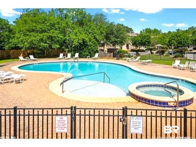 25806 Pollard Road, Unit 20 Daphne, AL 36526 - Photo 28 of 29 View of pool featuring a patio and a hot tub