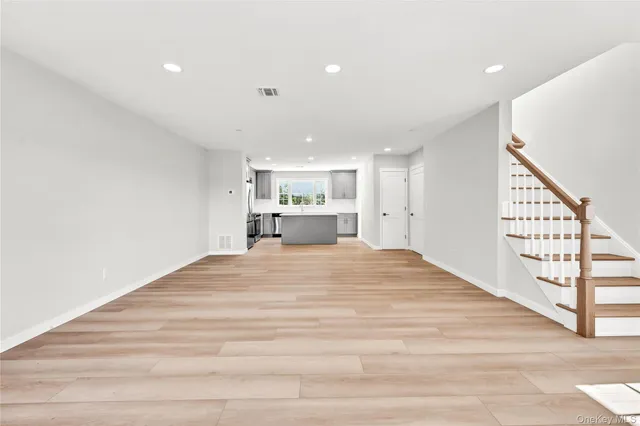 a room with a bed and a large window