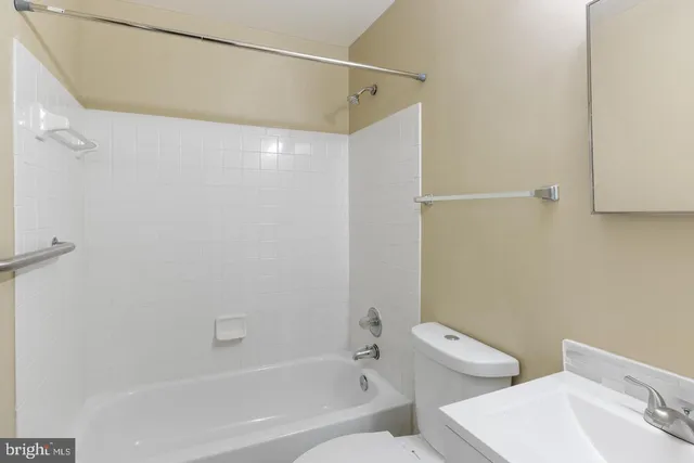 a bathroom with a bathtub and shower