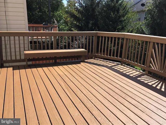 a view of balcony with wooden floor