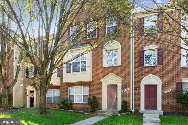 a front view of a house with yard
