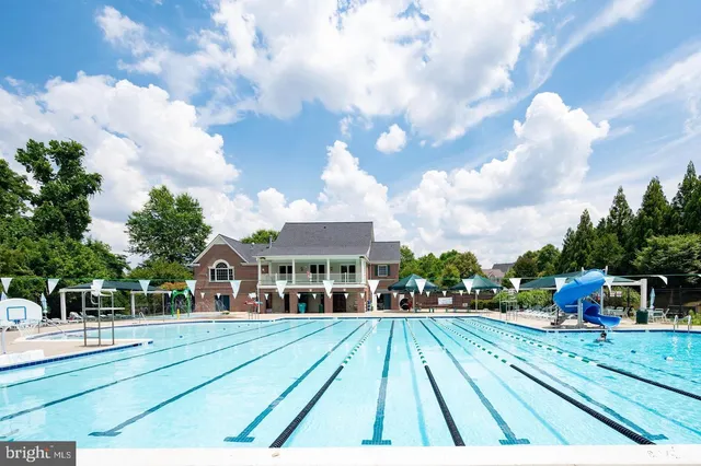 a view of multiple houses with a yard