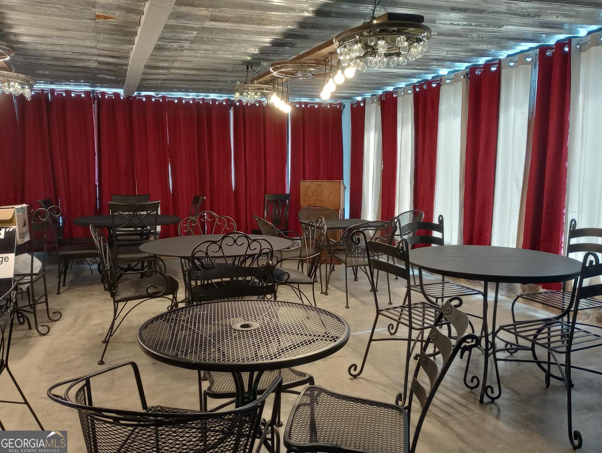 364 Pleasant Valley Road Southeast Silver Creek, GA 30173 - Photo 18 of 18 a view of a chairs and table in a patio