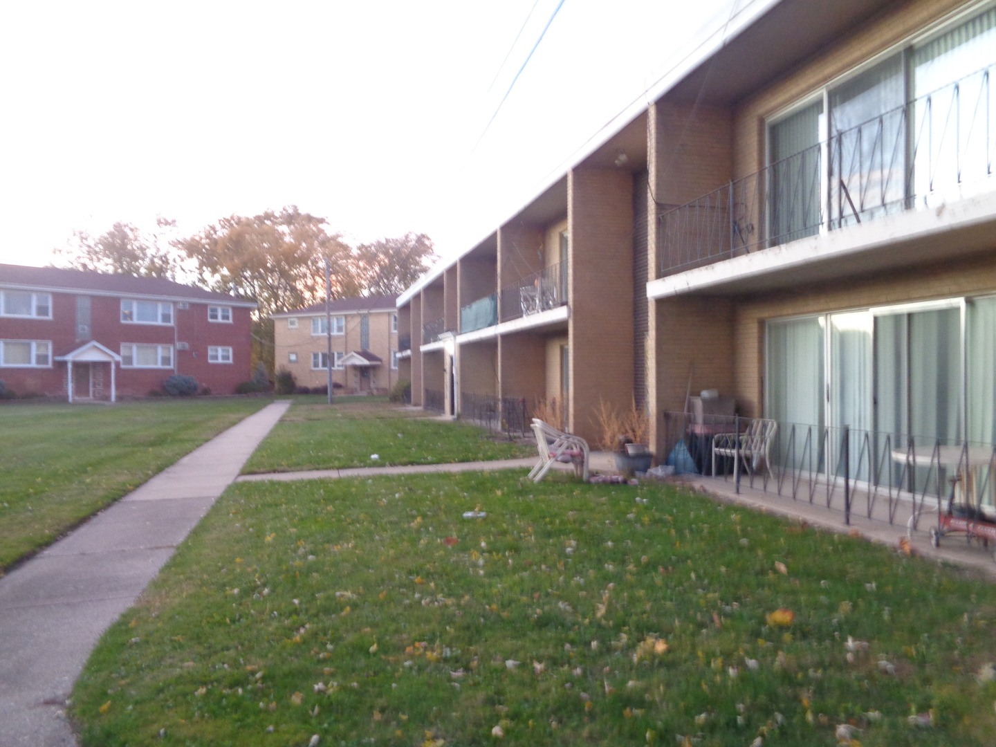 5818 107th Ct Way, Unit 10 Chicago Ridge, IL 60415 - Photo 1 of 7 a view of a house with a yard and sitting area