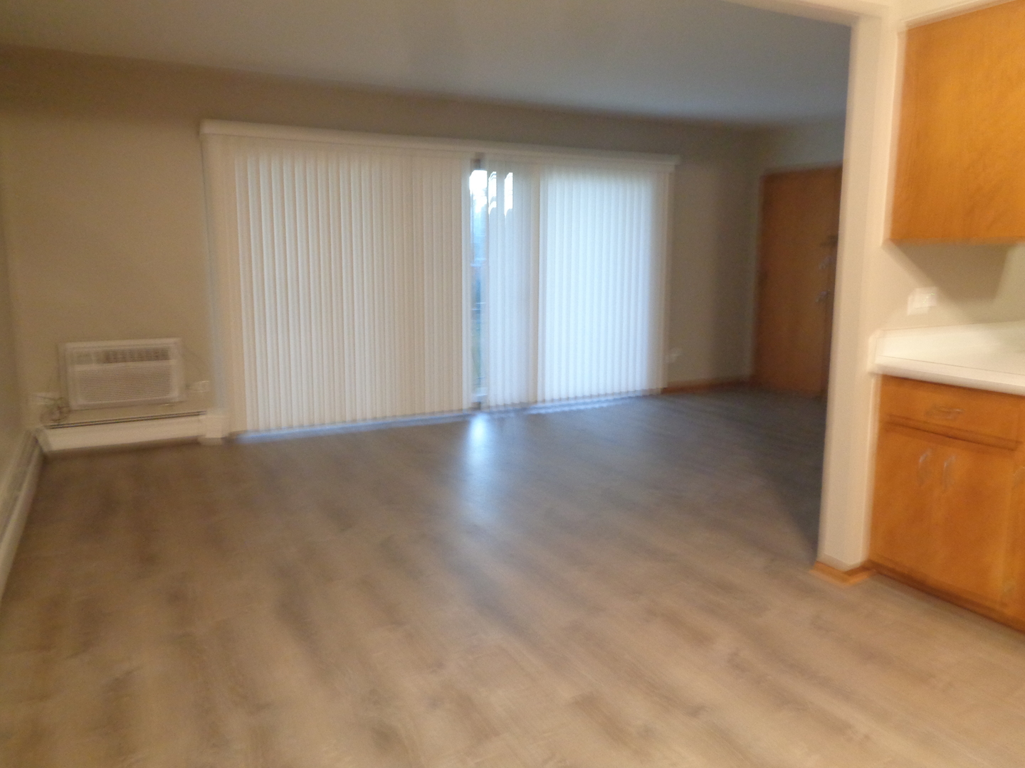 5818 107th Ct Way, Unit 10 Chicago Ridge, IL 60415 - Photo 2 of 7 a view of an empty room with a window