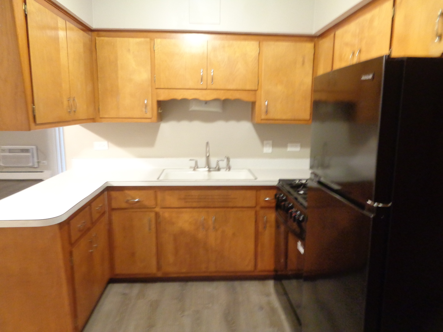 5818 107th Ct Way, Unit 10 Chicago Ridge, IL 60415 - Photo 4 of 7 a bathroom with a sink and a mirror