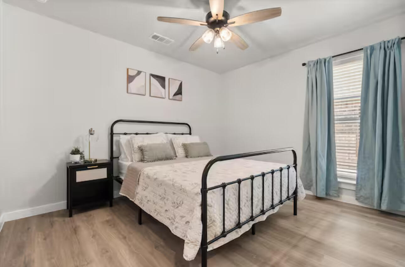 3518 Turner Avenue Lubbock, TX 79407 - Photo 7 of 12 a bedroom with a bed and window