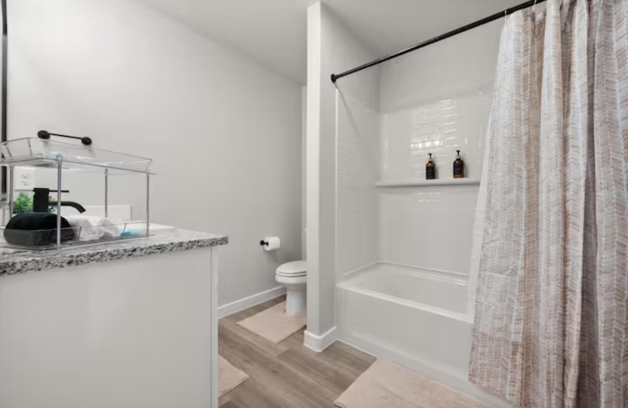 3518 Turner Avenue Lubbock, TX 79407 - Photo 10 of 12 a bathroom with a granite countertop sink and a mirror