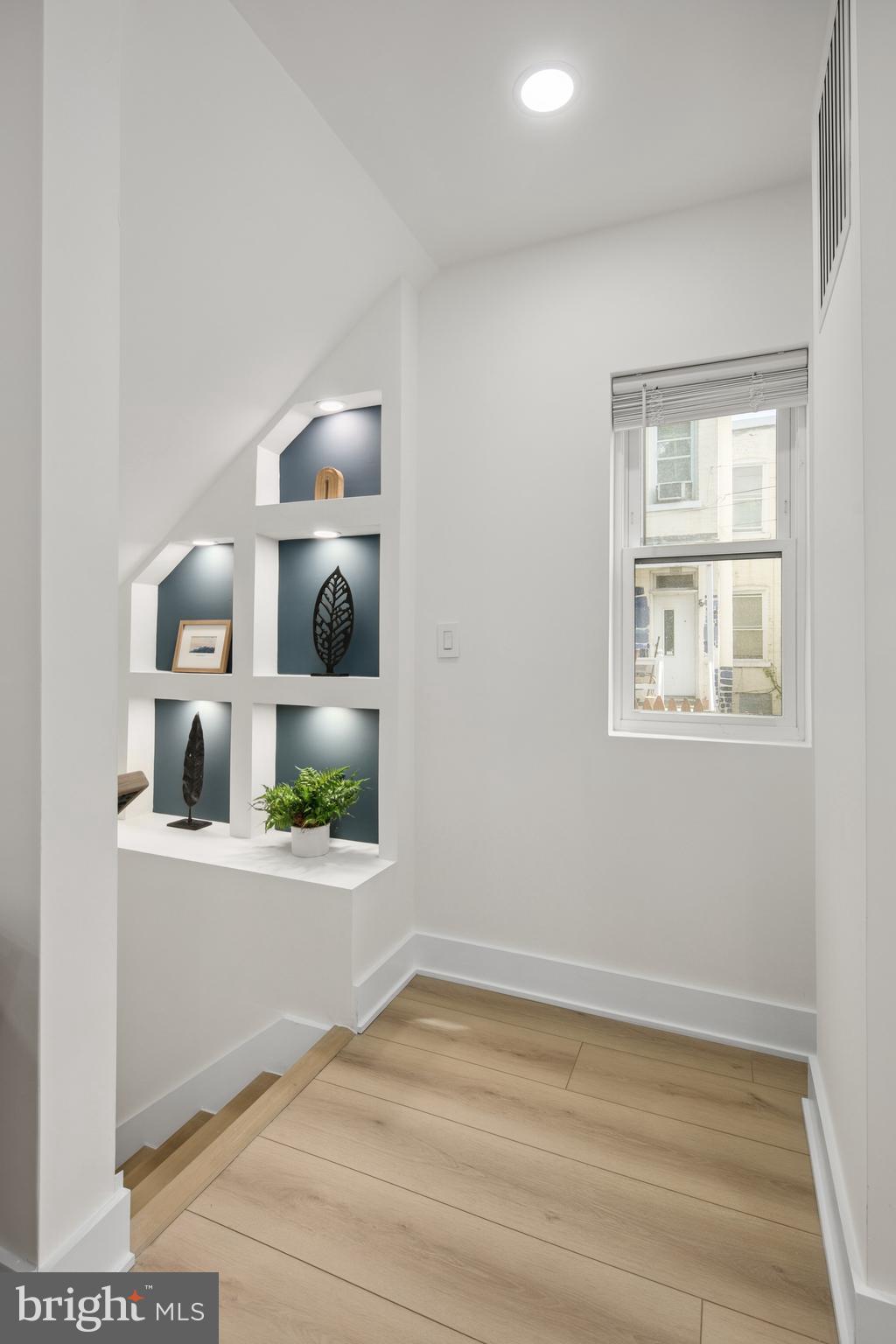 655 Morton Place Northeast, Unit 1 Washington, DC 20002 - Photo 12 of 26 an empty room with window and wooden floor