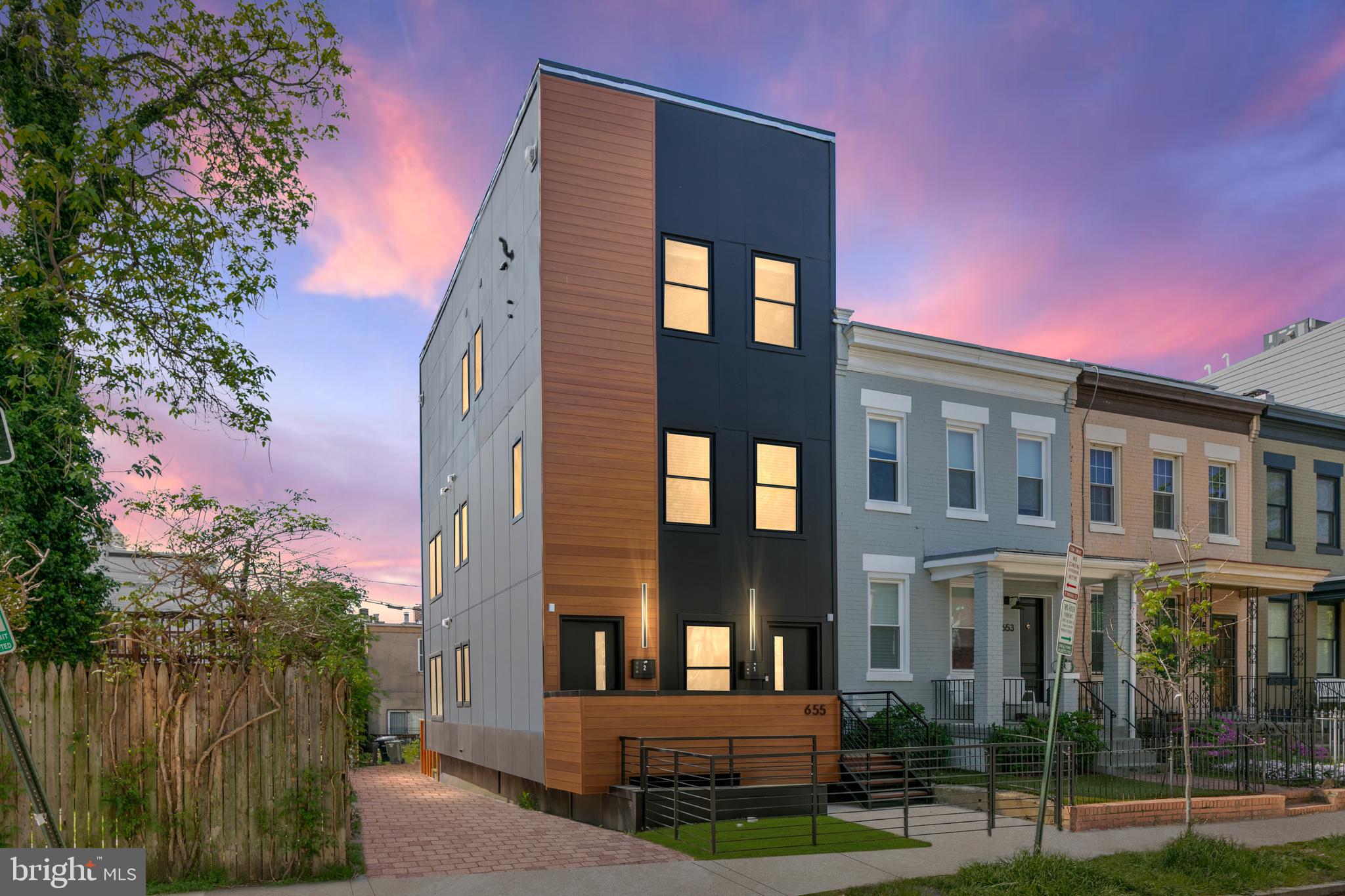 655 Morton Place Northeast, Unit 1 Washington, DC 20002 - Photo 26 of 26 a front view of a building with a garden