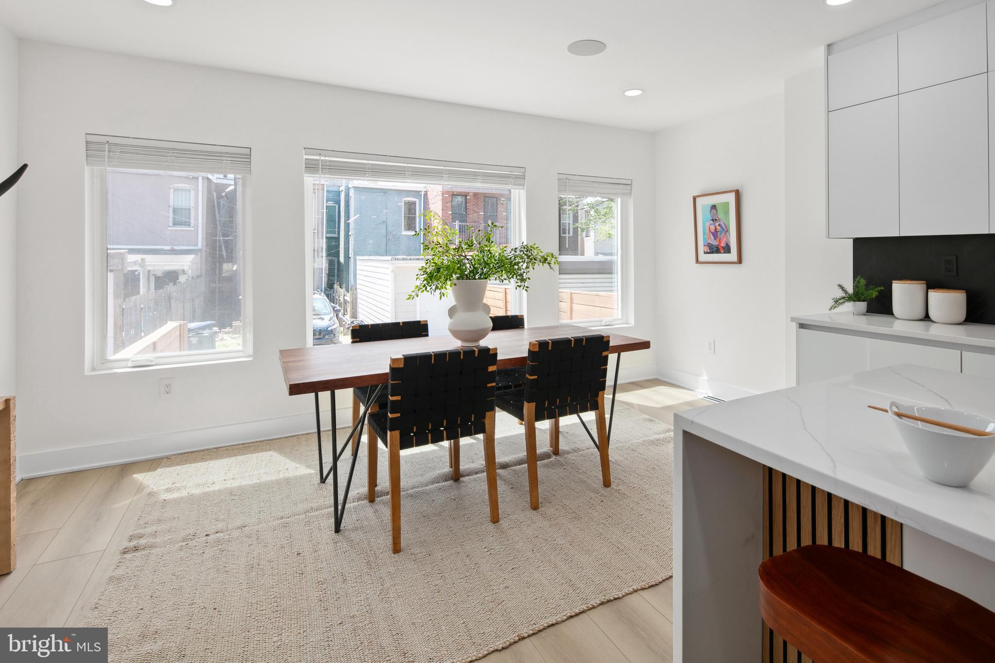 655 Morton Place Northeast, Unit 1 Washington, DC 20002 - Photo 9 of 26 a view of a dining room with furniture and a potted plant