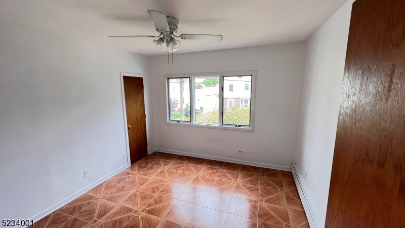 74 Mill Street Bloomfield, NJ 07003 - Photo 7 of 10 a view of an empty room and window