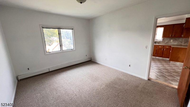 74 Mill Street Bloomfield, NJ 07003 - Photo 8 of 10 an empty room with a window