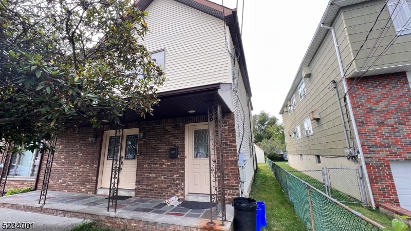 74 Mill Street Bloomfield, NJ 07003 - Photo 10 of 10 front view of a house with an trees