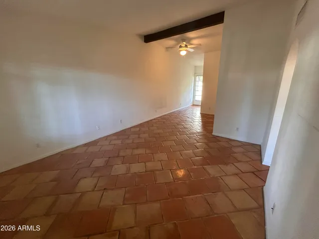 a view of an empty room and window