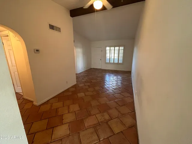 a view of an empty room and window