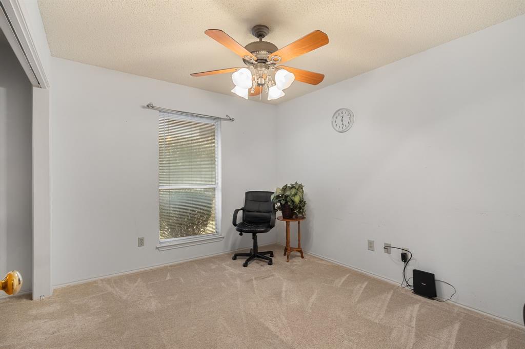2708 Whitby Lane Grapevine, TX 76051 - Photo 20 of 32 a living room with furniture and a window