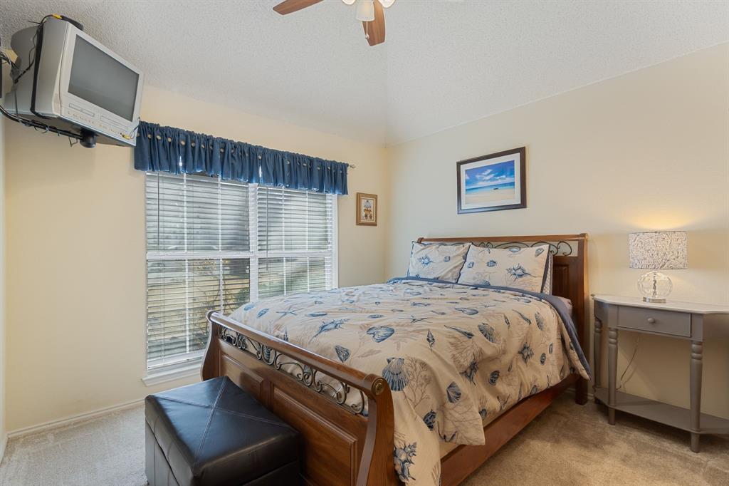 2708 Whitby Lane Grapevine, TX 76051 - Photo 21 of 32 a bedroom with a bed and a window