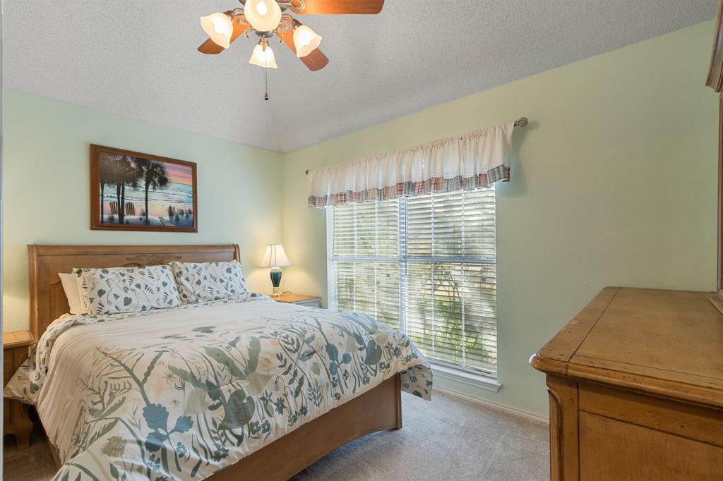 2708 Whitby Lane Grapevine, TX 76051 - Photo 22 of 32 a bedroom with a bed and a window
