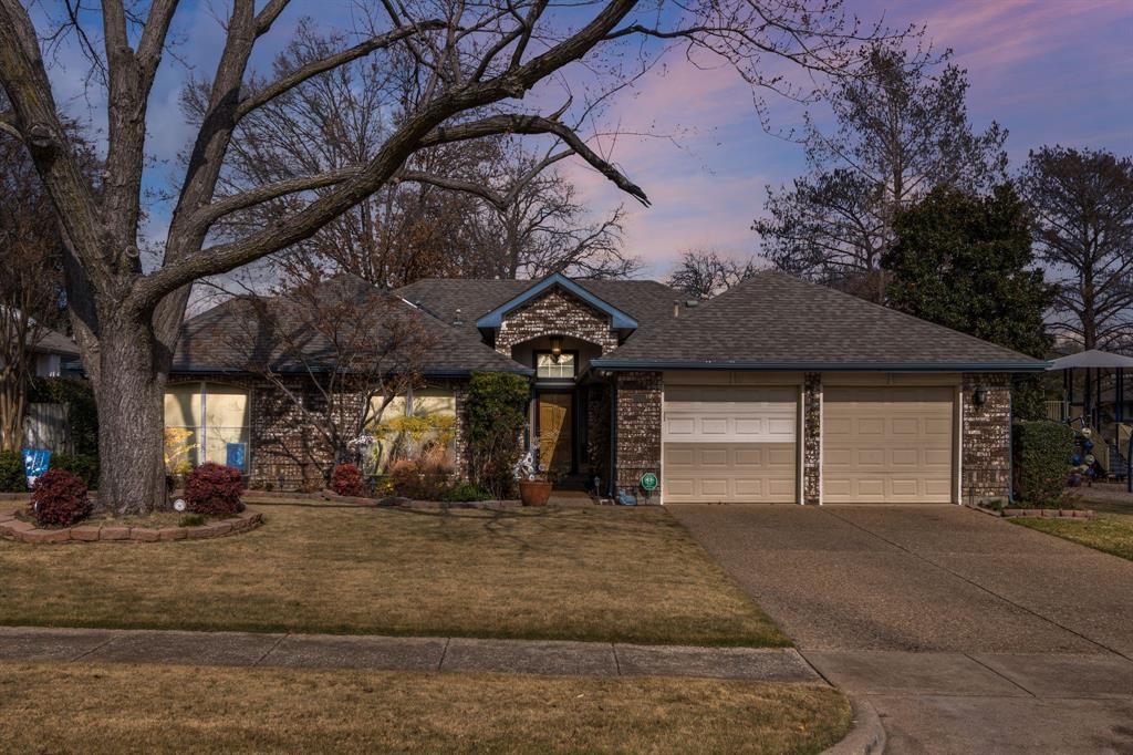2708 Whitby Lane Grapevine, TX 76051 - Photo 32 of 32 a front view of a house with a yard and garage