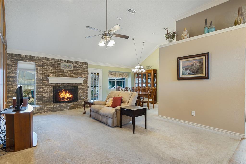 2708 Whitby Lane Grapevine, TX 76051 - Photo 5 of 32 a living room with furniture and a fireplace