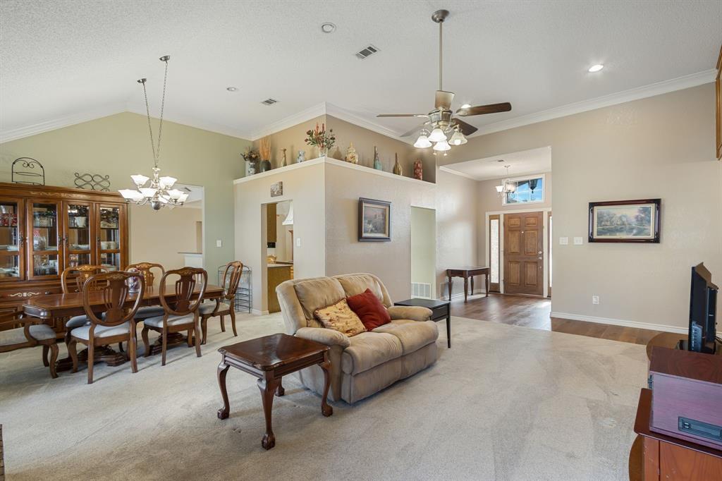 2708 Whitby Lane Grapevine, TX 76051 - Photo 6 of 32 a living room with furniture a chandelier and a chandelier