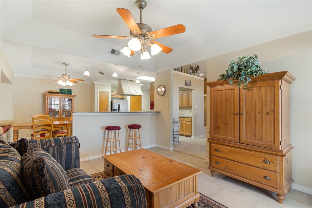 2708 Whitby Lane Grapevine, TX 76051 - Photo 10 of 32 a living room with furniture and a chandelier