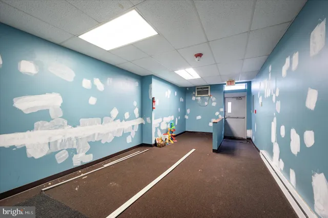 a lobby with furniture and window