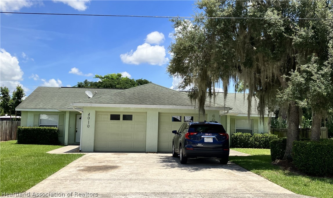 4010 Leaf Road Sebring, FL 33875 - Photo 1 of 35 a front view of a house with a garden