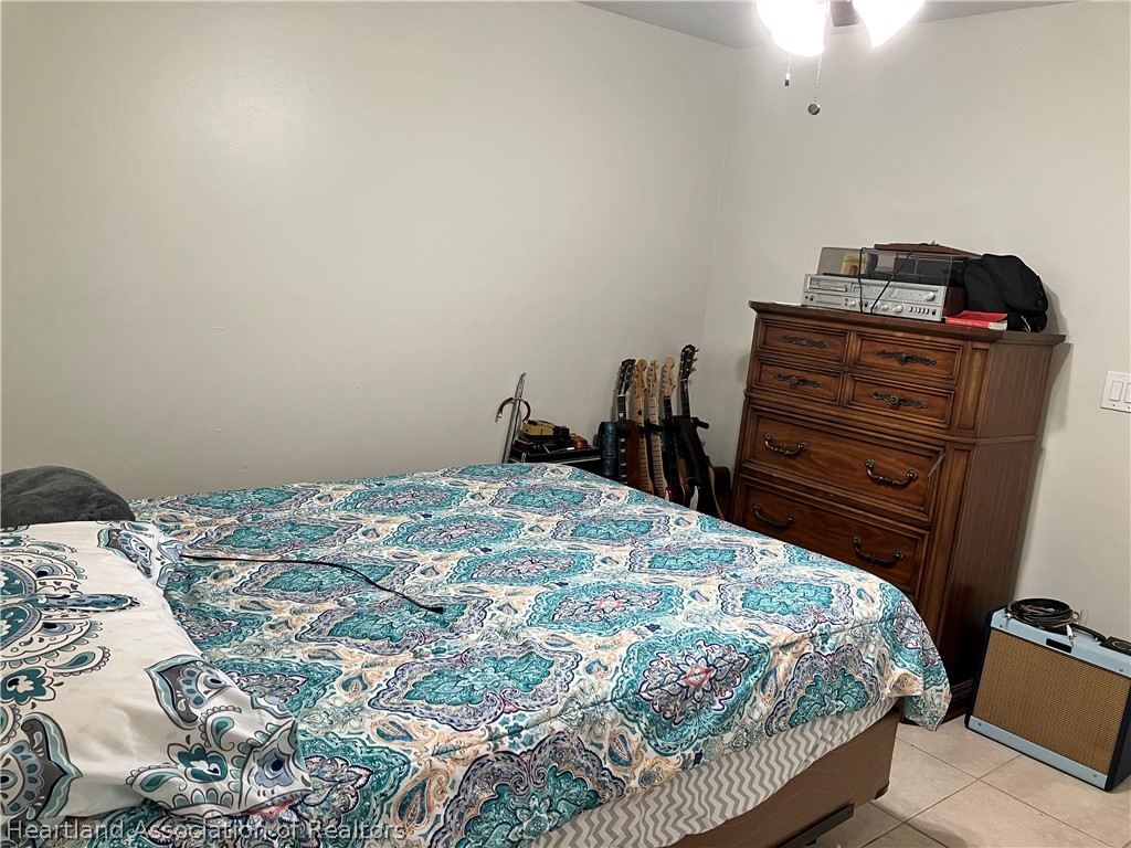 4010 Leaf Road Sebring, FL 33875 - Photo 11 of 35 a bedroom with a bed and dresser