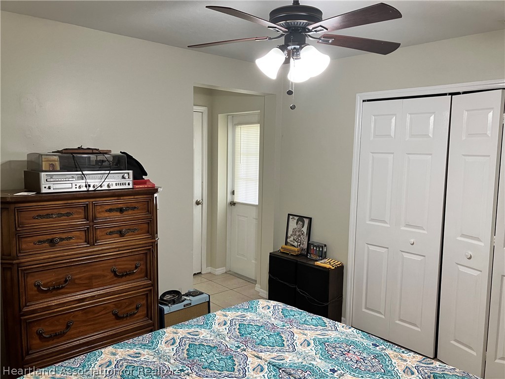 4010 Leaf Road Sebring, FL 33875 - Photo 12 of 35 a bedroom with a bed and a dresser