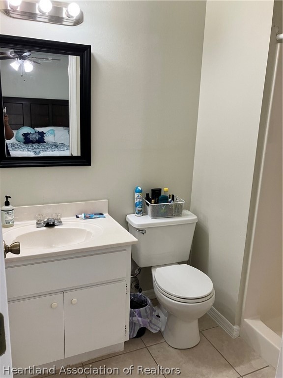 4010 Leaf Road Sebring, FL 33875 - Photo 14 of 35 a bathroom with a toilet a sink and mirror