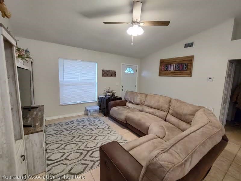 4010 Leaf Road Sebring, FL 33875 - Photo 20 of 35 a living room with furniture and a flat screen tv