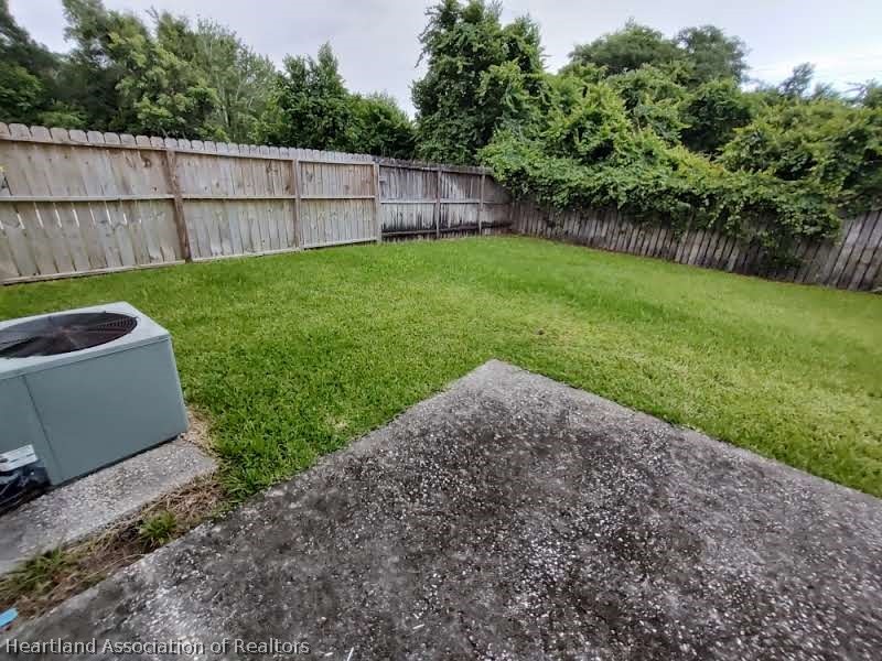 4010 Leaf Road Sebring, FL 33875 - Photo 32 of 35 a view of a backyard with a small cabin and wooden fence