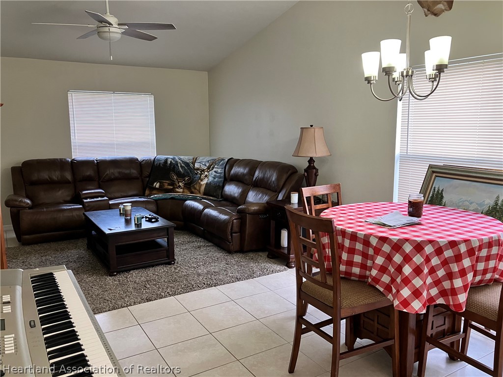 4010 Leaf Road Sebring, FL 33875 - Photo 6 of 35 a living room with furniture and a chandelier