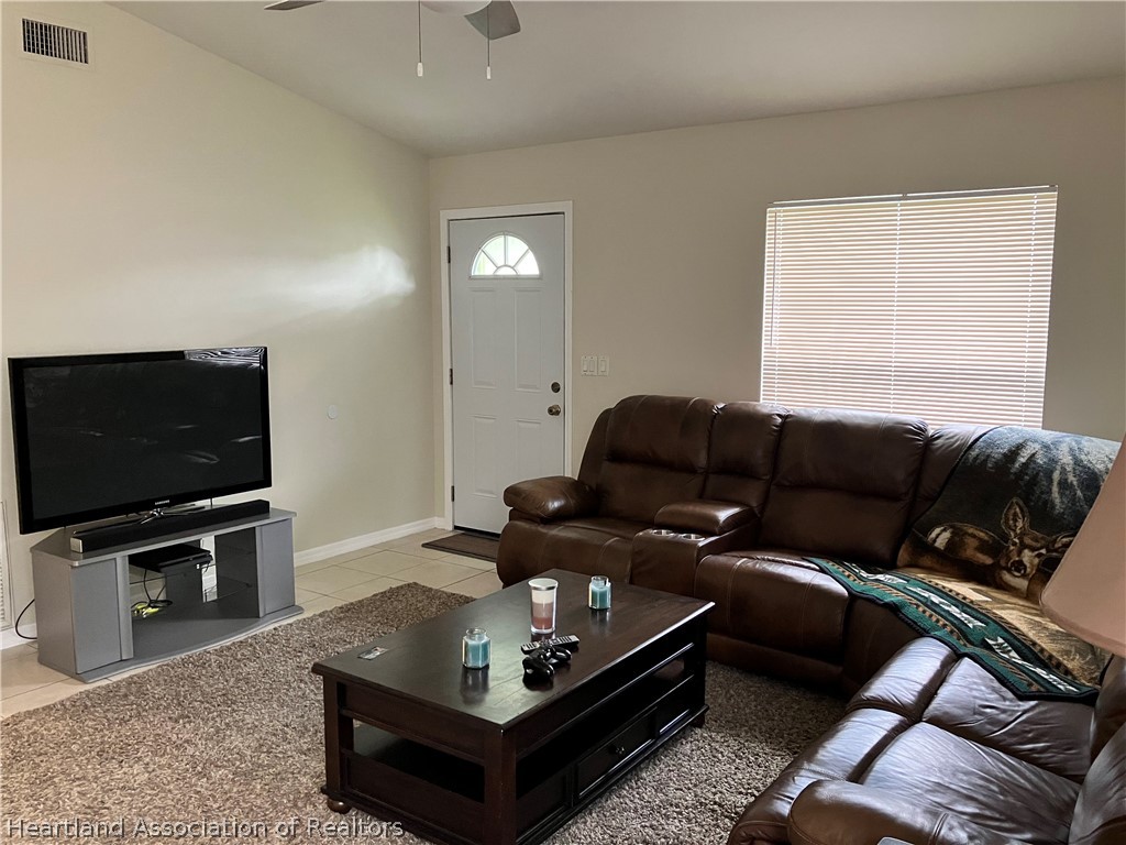 4010 Leaf Road Sebring, FL 33875 - Photo 7 of 35 a living room with furniture and a flat screen tv